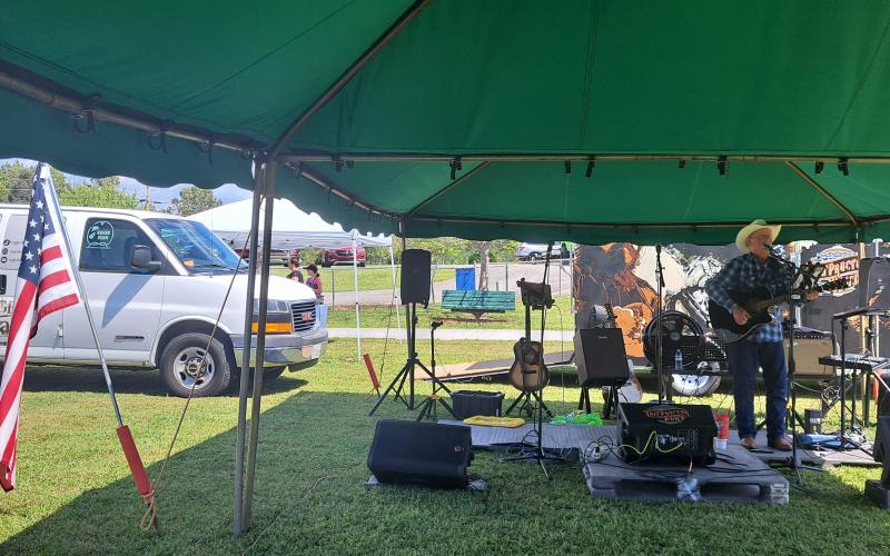 Megan Horn/The Clayton Tribune. Musician Roger Dean performs for event-goers at the Tiger Corn Festival on Saturday, Sept. 21.