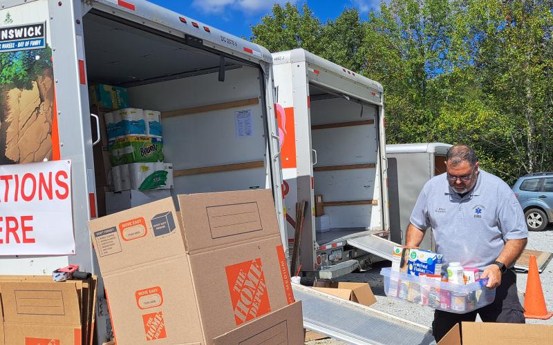 Megan Horn/The Clayton Tribune. Emergency personnel from Station 1 in Clayton collect items for hurricane victims Wednesday. The drop-off will be at 36 Emergency Drive, Clayton until around noon Friday. Oct. 4.