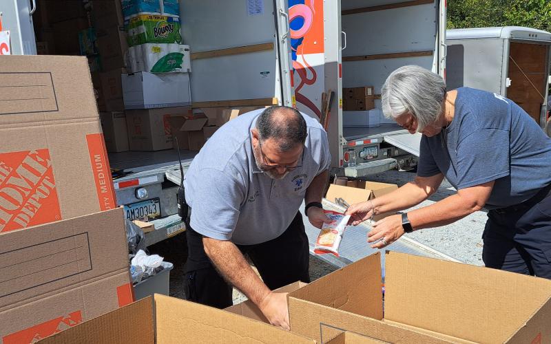 Megan Horn/The Clayton Tribune. Emergency personnel from Station 1 in Clayton collect items for hurricane victims Wednesday. The drop-off will be at 36 Emergency Drive, Clayton until around noon Friday. Oct. 4.