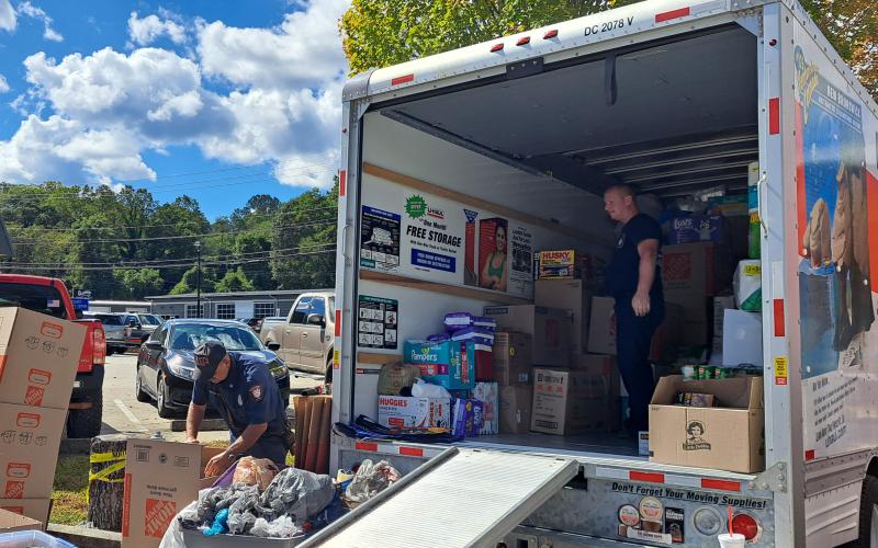 Megan Horn/The Clayton Tribune. Emergency personnel from Station 1 in Clayton collect items for hurricane victims Wednesday. The drop-off will be at 36 Emergency Drive, Clayton until around noon Friday. Oct. 4.