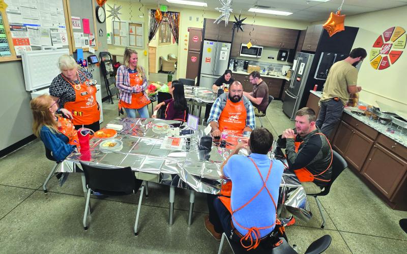 Enoch Autry/The Clayton Tribune. The Home Depot in Clayton associates enjoy a celebratory meal in honor of their six consecutive years of safety excellence.