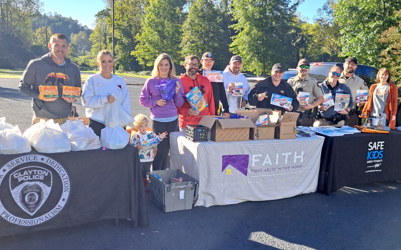 Megan Horn/The Clayton Tribune. The Clayton Police Department, Rabun County Sheriff’s Office, and Fight Abuse In The Home (F.A.I.T.H.) along with the Food Bank of Northeast Georgia, faith-based organizations and churches distributed food and literature as a way to build connections with the community during Faith &amp; Blue weekend on Saturday, Oct. 12. Below: Submitted photo. The Clayton Police Department and nonprofit Fight Abuse In The Home (F.A.I.T.H.) held a blood drive in the community on Friday, Oct. 11.