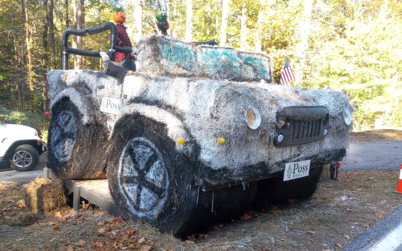 Submitted photo. Poss Realty was awarded first place in the Sky Valley Hay Bale Trail with this creatively decorated Jeep made out of hay and painted. Below: Veterans of Foreign Wars (VFW) Post 4570 cooked hotdogs for the community at the Sky Valley Fall Fest.