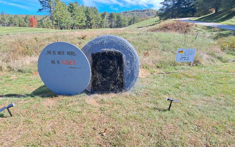 Megan Horn/The Clayton Tribune. Chapel of Sky Valley decorated this hay bale with Matthew 28:6 scripture :"HE IS NOT HERE; HE IS RISEN." Below: Veterans of Foreign Wars (VFW) Post 4570 cooked hotdogs for the community at the Sky Valley Fall Fest.