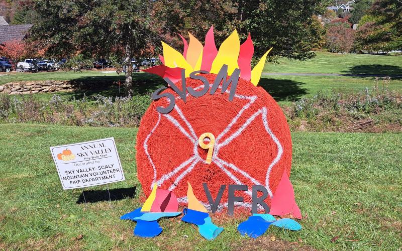 Megan Horn/The Clayton Tribune. Sky Valley-Scaly Mountain Volunteer Fire and Rescue decorated this colorful hay bale for the Sky Valley Hay Bale Trail. Below: Veterans of Foreign Wars (VFW) Post 4570 cooked hotdogs for the community at the Sky Valley Fall Fest.