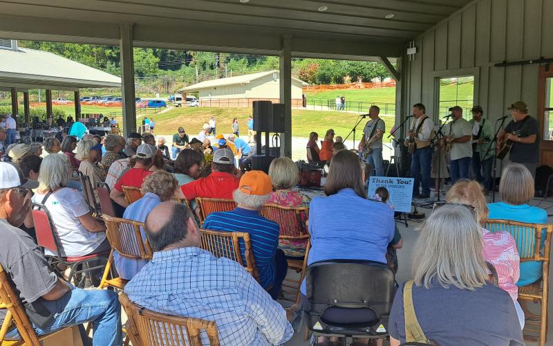 Megan Horn/The Clayton Tribune. A huge crowd enjoys a live musical performance by The Foxfire Boys at the Foxfire Mountaineer Festival. Below: Submitted photo from the Foxfire Mountaineer Festival.