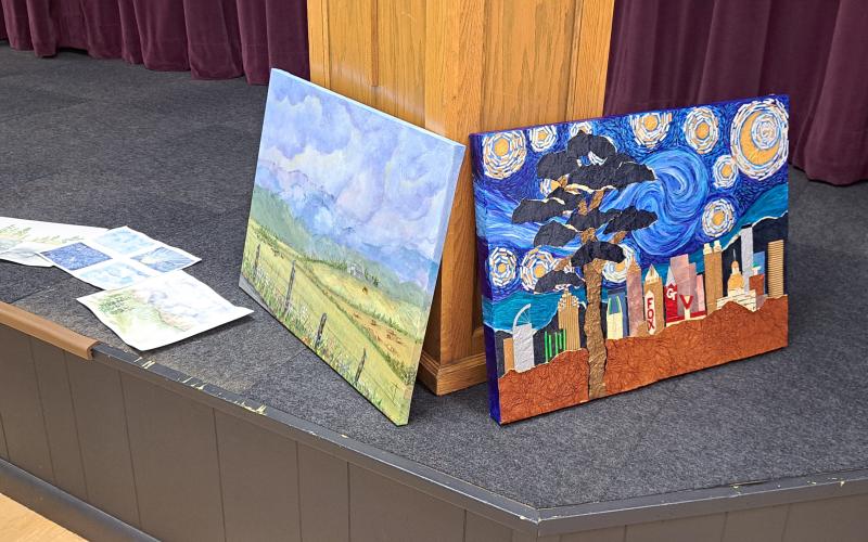 Megan Horn/The Clayton Tribune. North Georgia Arts Guild members showcased their creative artwork at the Show and Tell themed "Detour" on Oct. 17. Below:  Joey Aldrich-Burel presents her painting in pastels that was inspired by Vincent Van Gogh.