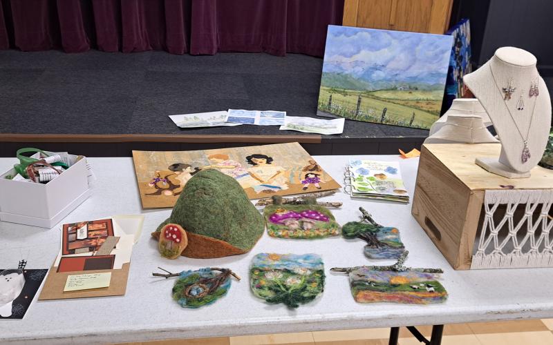 Megan Horn/The Clayton Tribune. North Georgia Arts Guild members showcased their creative artwork at the Show and Tell themed "Detour" on Oct. 17. Below:  Joey Aldrich-Burel presents her painting in pastels that was inspired by Vincent Van Gogh.