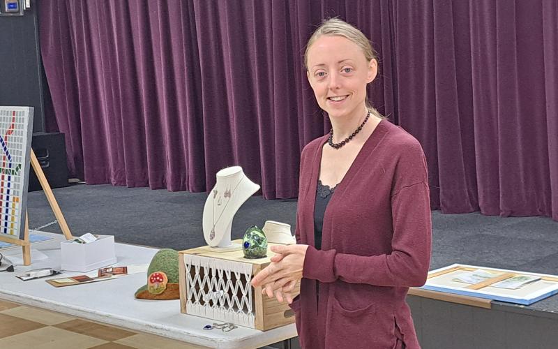 Megan Horn/The Clayton Tribune. Kristina Hadley said her detour was taking a step back and trying something different by using resin and making unique and color jewelry. Below:  Joey Aldrich-Burel presents her painting in pastels that was inspired by Vincent Van Gogh.