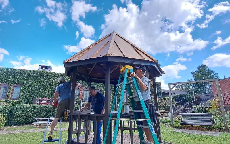 Megan Horn/The Clayton Tribune. Veterans of Foreign Wars (VFW) Post 4570 members work hard to keep the gazebo and Veterans Memorial Park looking nice for the community. Gary Cantwell-Army; Mark Edwards-Navy; David Bussiere-Air Force and Jon Jones-Army worked to serve their community at home.