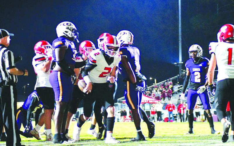 Enoch Autry/The Clayton Tribune. Junior Wildcat quarterback Ty Truelove’s rushing touchdown tied the score at 7-7 as Rabun County was on the road in the first round of the state football playoffs in Fitzgerald. The Purple Hurricane would prevail, 42-21.