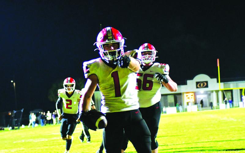 Enoch Autry/The Clayton Tribune. Junior Wildcat running back Lake Evans scores his first of two touchdowns on the road in the first round of the state football playoffs in Fitzgerald. The Purple Hurricane would prevail, 42-21.