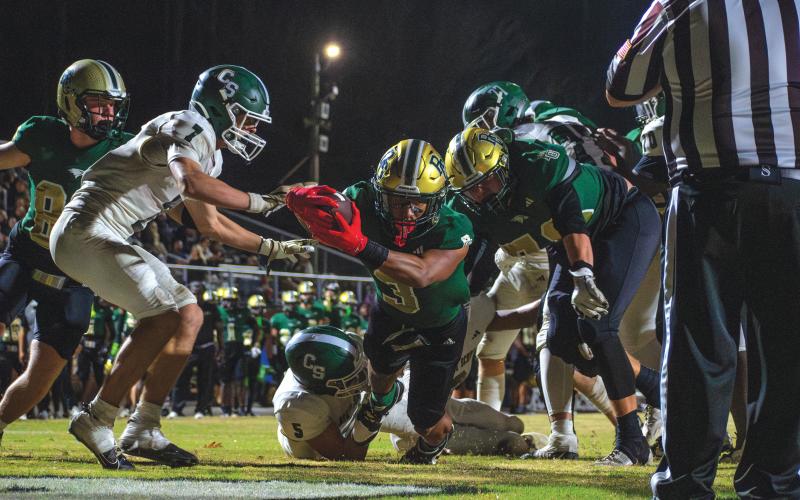Wade Cheek/The Clayton Tribune. Rabun Gap senior running back Anthony Quinn Jr. stretches out for an Eagles’ rushing touchdown in their semifinal win over the Christ School, 42-7. In a title game rematch, Providence Day comes to RGNS Friday.