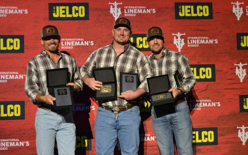 Submitted photo. HEMC linemen Dillon Welborn (left) Robert Morris, and Tucker Dyer stand with their awards.