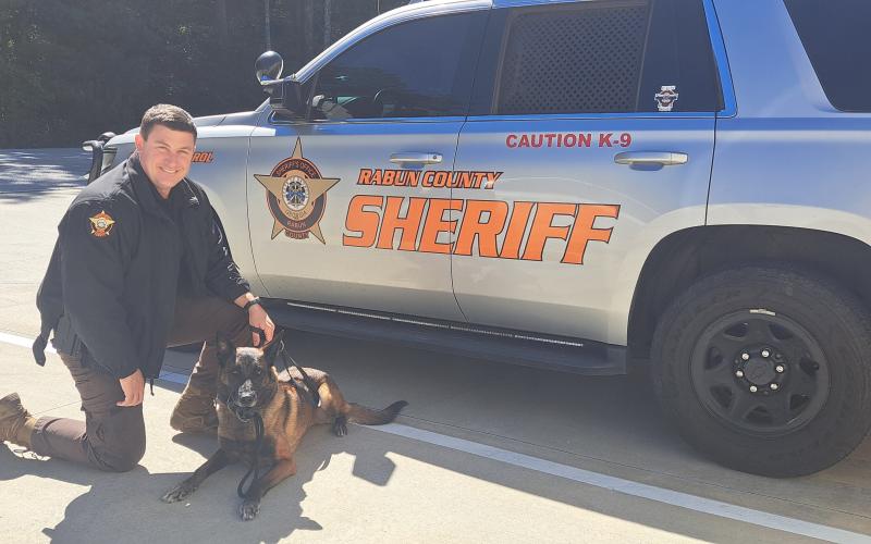 Megan Horn/The Clayton Tribune. K9 Doug retired from the RCSO on Oct. 1 at the age of 8. Pictured with Handler Sgt. Brandon Hyer, the pair worked as partners for seven years to seize pounds of narcotics.