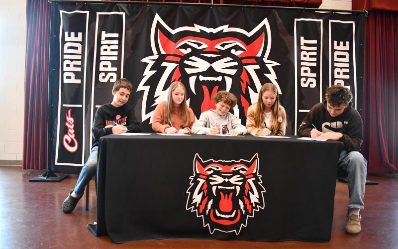 Megan Horn/The Clayton Tribune. Rabun County Schools 2024-2025 REACH Scholars are Mason Beck, Danika Crane, Jessa Gipson, Everett Goodrow and Brayden Wood. The students were honored and had their scholarship signing ceremony on Nov. 21 in the Rabun County High School Fine Arts Building Band Room among family, friends, community supporters and school administrators.