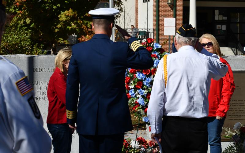 Megan Horn/The Clayton Tribune. Capt. (Ret.) Eric Vogelbacher, left, and Major (RET) Doug Wayne-DAV Ch. 15, Post 220, VFW Post 4570, SCV Camp 1929, salute after the Placing of the Wreath on Nov. 11.