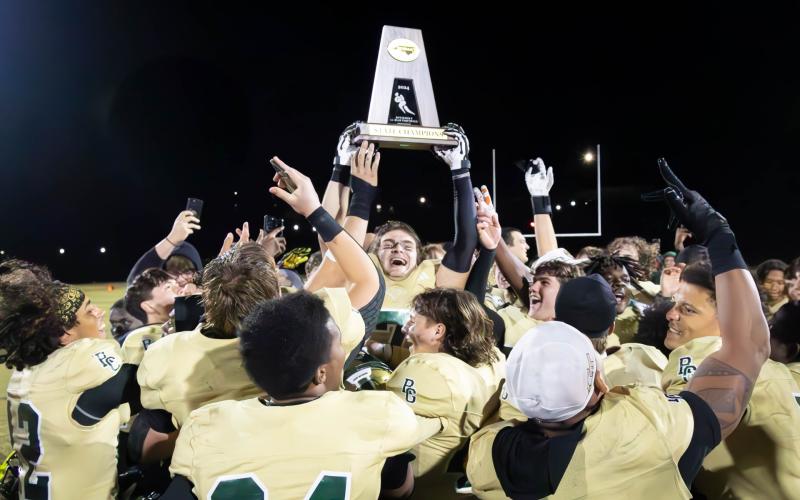 Wade Cheek/The Clayton Tribune. The Rabun Gap-Nacoochee School football team claims its first-ever state title after defeating Providence Day 42-39 in the NCISAA 4A state championship game on Friday, Nov. 15.