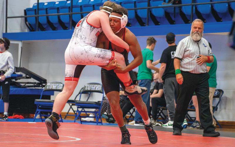 Wade Cheek/The Clayton Tribune. Shaun Fruster hoists up a Chattooga opponent in his first match of the King of the Mountain tournament. Fruster won the match by fall.