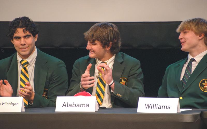 Wade Cheek/The Clayton Tribune. RGNS senior tight end Marshall Pritchett celebrates signing his NLI with the University of Alabama. Pritchett is one of eight Rabun Gap football players to sign to play college football this season. RGNS senior tight end Marshall Pritchett celebrates signing his NLI with the University of Alabama. Pritchett is one of eight Rabun Gap football players to sign to play college football this season.