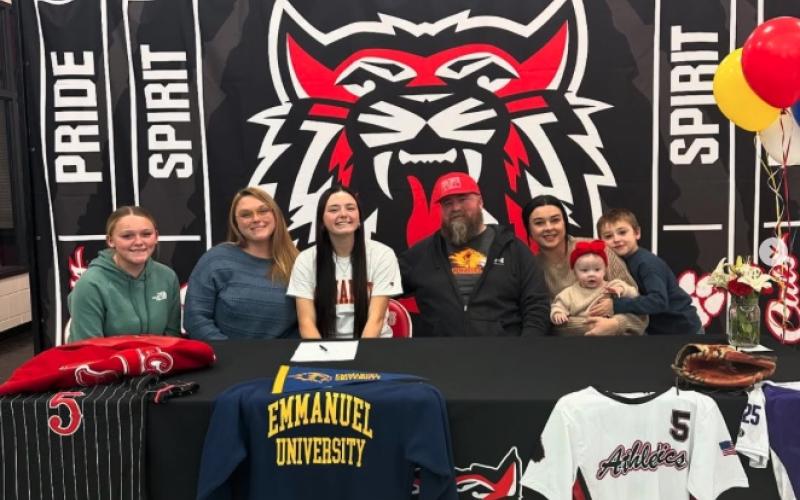Wade Cheek/The Clayton Tribune. RCHS senior softball and basketball player Jacie McCall recently signed her NLI to play softball at the collegiate level with Emmanuel University in Franklin Springs.