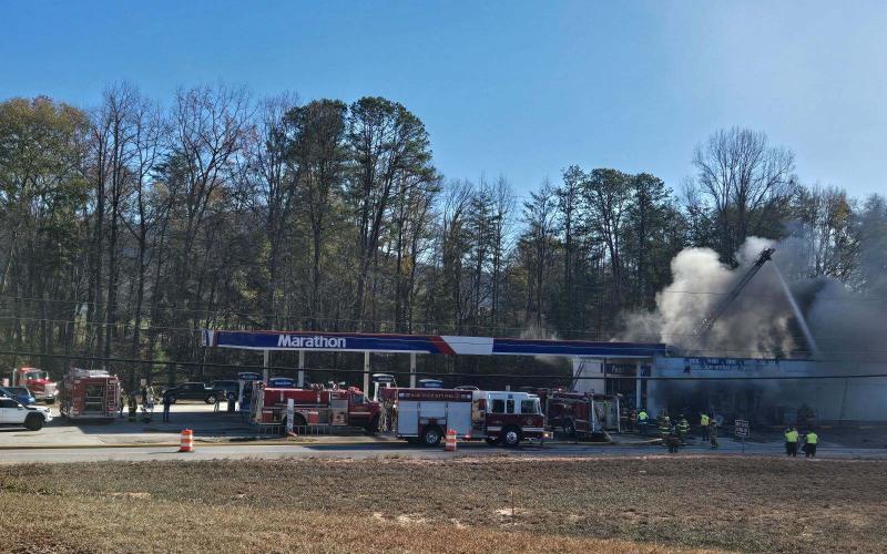 Photo courtesy Megan Morris. Firefighters from Rabun County Fire Services Stations 5, 1, 6, 9, 12 as well as Otto (N.C.) Fire and Rescue work to extinguish a commercial structure fire at 6676 Highway 441 North (Marathon station) in Dillard on Saturday, Dec. 7. The building is a “total loss.”