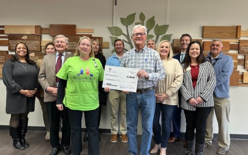 Submitted photo. Carolyn Dillard, board chairman for Richard’s Kids, and Pat Henry, treasurer, receive a $4,000 grant from the North Georgia Community Foundation at its headquarters in Gainesville on Dec 6.