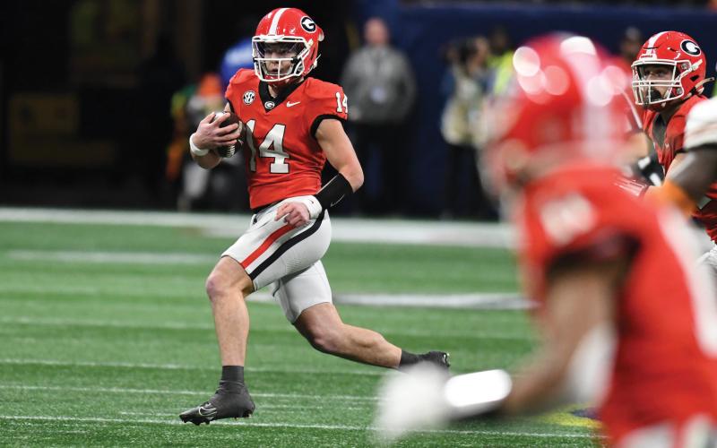 Wade Cheek/The Clayton Tribune. Former Rabun County football quarterback Gunner Stockton came into the second half of last Saturday’s SEC Championship against Texas after starting QB Carson Beck went down with an injury. Stockton led the now No. 2 Bulldogs to a 22-19 OT victory.