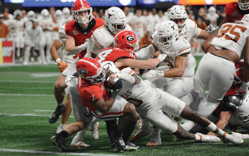 Wade Cheek/The Clayton Tribune. Georgia running back Trevor Etienne scored the winning touchdown in overtime that allowed UGA to defeat Texas and win this year’s SEC championship on Saturday, Dec. 7. Etienne had 94 rushing yards on 16 carries with two touchdowns.