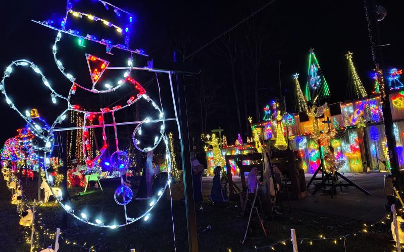 Megan Horn/The Clayton Tribune. Glowing characters and the sounds of holiday music greet visitors to the Christmas Village of Lights displayed at 90 Tiger Connector, Tiger.