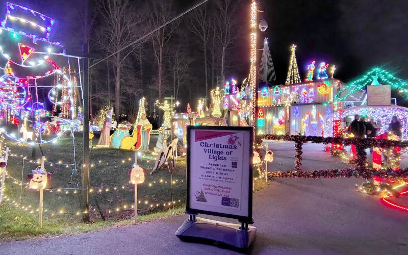 Megan Horn/The Clayton Tribune. Glowing characters and the sounds of holiday music greet visitors to the Christmas Village of Lights displayed at 90 Tiger Connector, Tiger.
