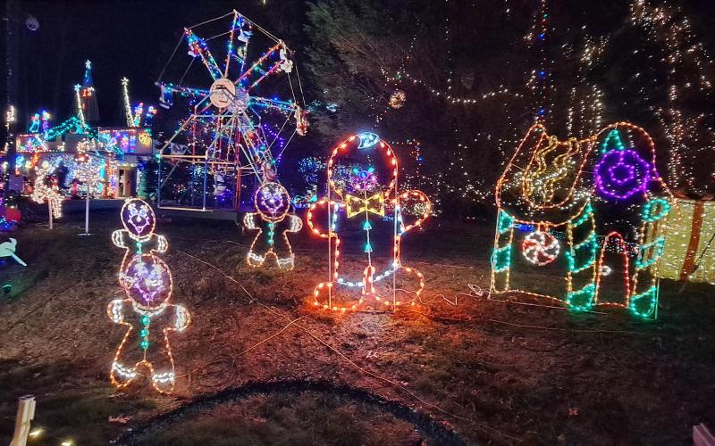 Megan Horn/The Clayton Tribune. These Gingerbread characters are some of the many colorful decorations featured at the Christmas Village of Lights in Tiger. There are two more chances to view the displays this weekend.