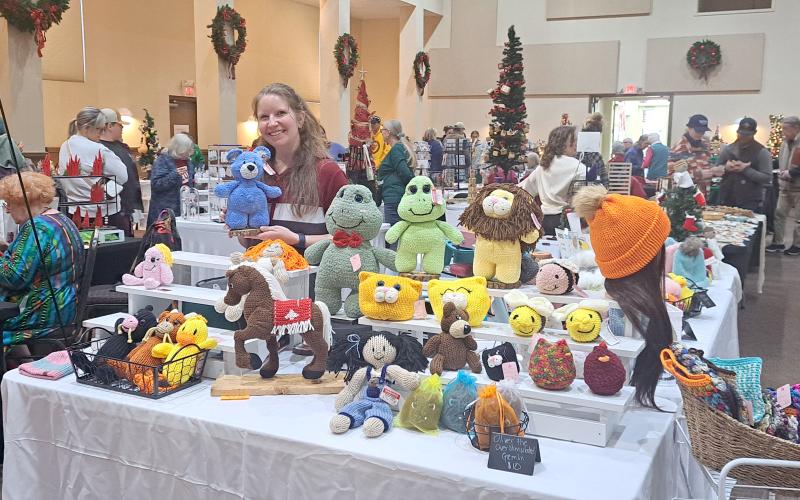 Megan Horn/The Clayton Tribune. Audrey Wood owns WoodWife Creations and showcases her creations during the Holiday Market last weekend. She said making the animals is a creative outlet and she loves being able to make them for her kids. Below: This Pokémon tree decorated by Guthrie Associates, Inc. was one of over 35 that community members could bid on at the Festival of Trees last weekend. This year’s beneficiary was the Creative Learning Center.
