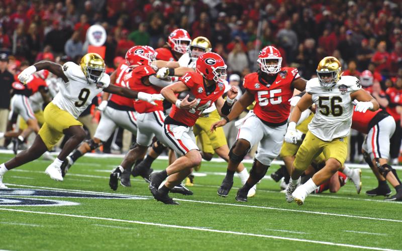 Wade Cheek/The Clayton Tribune. Gunner Stockton was forced to use his legs frequently in the 23-10 loss to Notre Dame in the Sugar Bowl. Stockton, who threw for 234 yards with a touchdown, was sacked four times.