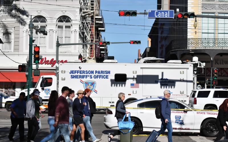 Wade Cheek/The Clayton Tribune.  A Jefferson Parish Sheriff’s Office emergency vehicle acts as a barrier on the Bourbon/Canal St. intersection to keep people away from the crime scene.