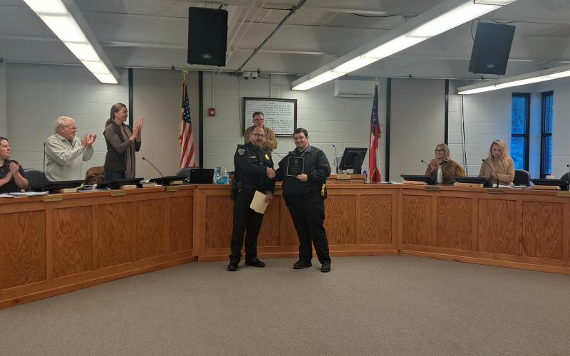 Megan Horn/The Clayton Tribune. Clayton Police Department Officer Jay Chastain III is presented with the 2025 Public Safety Award by Chief Andy Strait during the Jan. 14 city council meeting in a special ceremony.