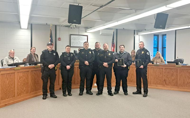 Megan Horn/The Clayton Tribune. Clayton Police Department Chief Andy Strait presents 2025 awards to officers and recognized their achievements during a special presentation at the Jan. 14 city council meeting. Pictured are Officer Jimmy Nations (left); Officer Sarah Chapman; Lt. Matthew Thomas; Sgt. Andy Beck; Strait; Officer Jay Chastain III; and Assistant Chief John Grist.