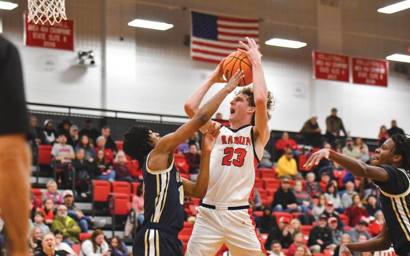 Wade Cheek/The Clayton Tribune. Rabun County junior post Hayes Free draws a foul at the rim during Rabun’s Sweet-16 loss to BEST Academy on Saturday, Feb. 22. Free scored a team-high 19 points against the Eagles.