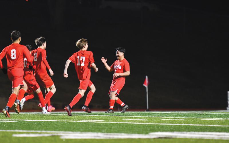 Wade Cheek/The Clayton Tribune. The Rabun County boys soccer team celebrates its victory over North Hall after winning in a penalty-kick shootout. The Wildcats were tied at zero with the Trojans before winning the tie-breaking shootout.