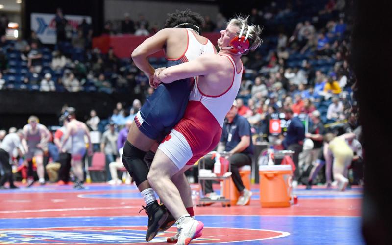 Wade Cheek/The Clayton Tribune. Senior wrestler Tucker Buchanan goes for a takedown slam of a Mt. Pisgah opponent in the quarterfinal of this year’s GHSA Traditional Wrestling tournament. Buchanan placed second in the 215-pound division of Georgia Class A-DI.