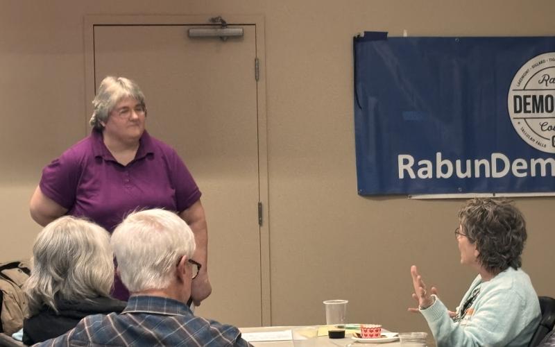 Submitted. Democrat Laura Hart asks Tammy Whitmire, elections and voter registration director, about the role that poll watchers play in servicing the community during the Feb. 10 meeting of the Rabun County Democrats.