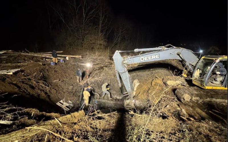 Submitted photo. Rabun County Water and Sewer Authority (RCWSA) employees spent 12 hours and worked throughout the night on Feb. 13 to restore water service after a 10-inch ductile iron water line was cut by a Georgia Department of Transportation contractor.