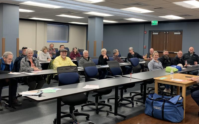 Submitted photo. A group of people listen to Rabun County EMS Capt. Trampes Stancil discuss health risks on Jan. 28 at the quarterly public health talk.