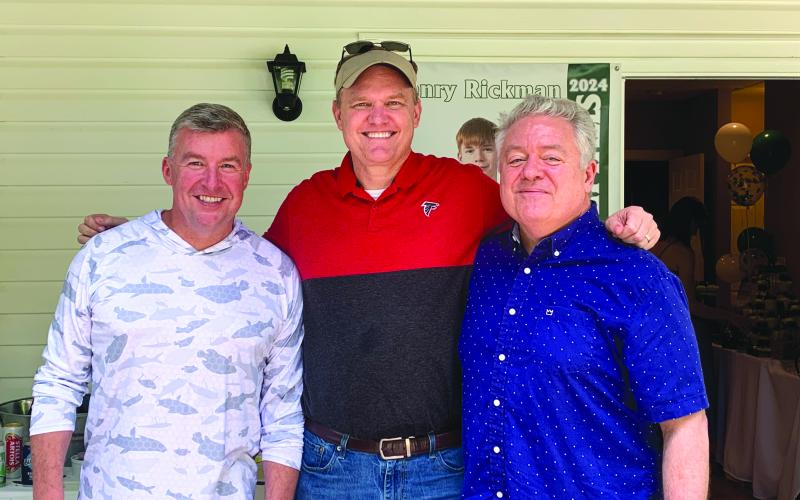 Photo courtesy of Georgia Court of Appeals Judge Brian Rickman. Stockton &amp; Stockton, LLC Attorney Allyn Stockton (left); Georgia Court of Appeals Judge Brian Rickman; and Superior Court Judge Russell “Rusty” Smith are pictured at a high school graduation party for Rickman’s son.