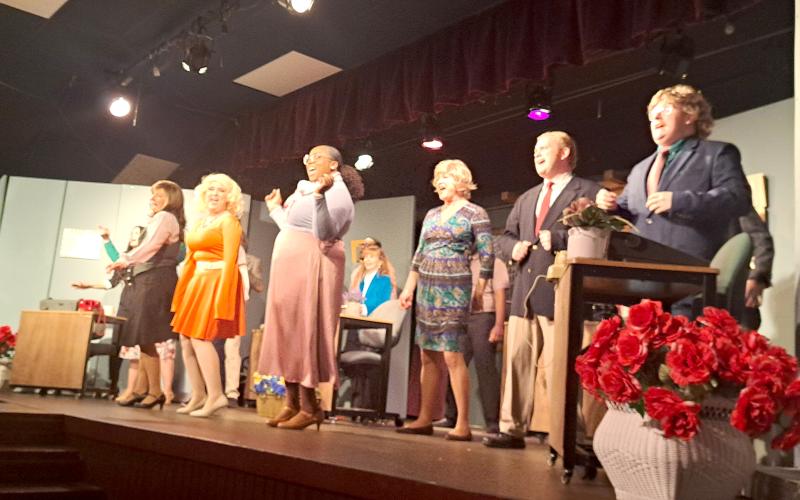 Megan Horn/The Clayton Tribune. Cast members sing the iconic song "9 to 5."