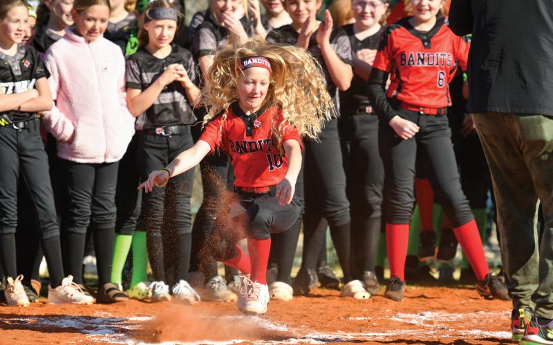 Wade Cheek/The Clayton Tribune. Maia Bearden shows off her dance moves during one of CJ Beatty’s songs at Rabun County Little League’s annual opening day ceremony.