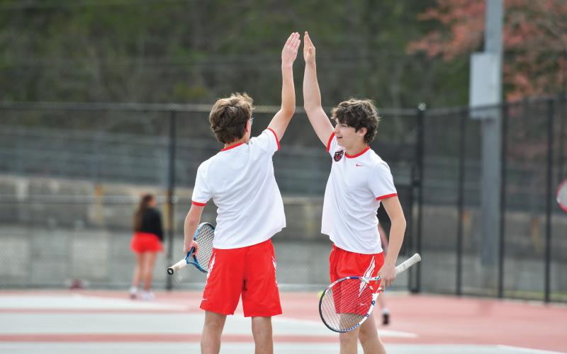 Wade Cheek/The Clayton Tribune. No. 1 Wildcat duo Robbie Fountain and Brady Darnell celebrate a point in their victory over Banks County’s duo (6-0, 6-4). The Wildcats defeated the Leopards 4-1.