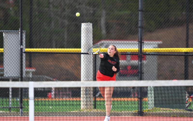 Wade Cheek/The Clayton Tribune. Senior tennis player Lucy Harvey won her No. 1 singles match (6-1,6-2) to help the lady Cats defeat region foe Banks County 4-1 on Monday, March 24.