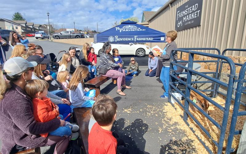 Megan Horn/The Clayton Tribune. Kim Cannon with Children’s Services at Rabun County Public Library reads “Miss MacDonald Had a Farm” by Kalee Gwarjanski during “On the Road Storytime.”