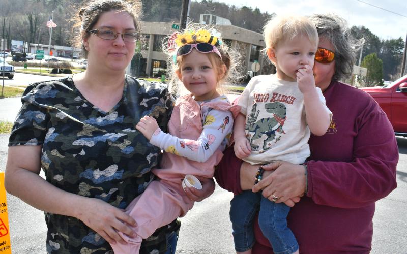 Megan Horn/The Clayton Tribune.  Jennifer Gantt, left; Davie Gantt, 4; Gauge Gantt, 1; and Margo Mitcham enjoy cheese curds from Farmstead Market on March 20.